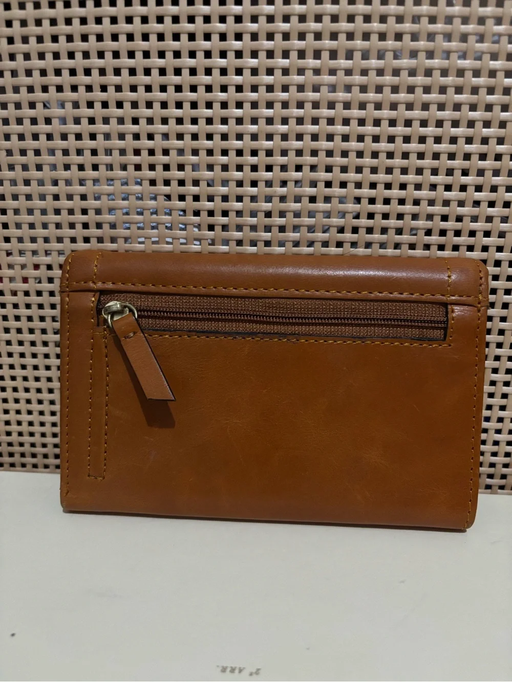 Lodis wallet brown leather featuring knotted tap detail